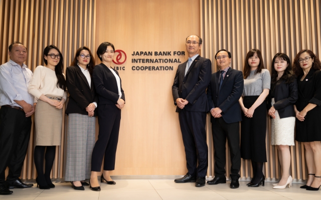 Photo of The representatives and staff of JBIC Representative Office in Hanoi. Their duties are diverse, from individual project support to research and policy dialogue