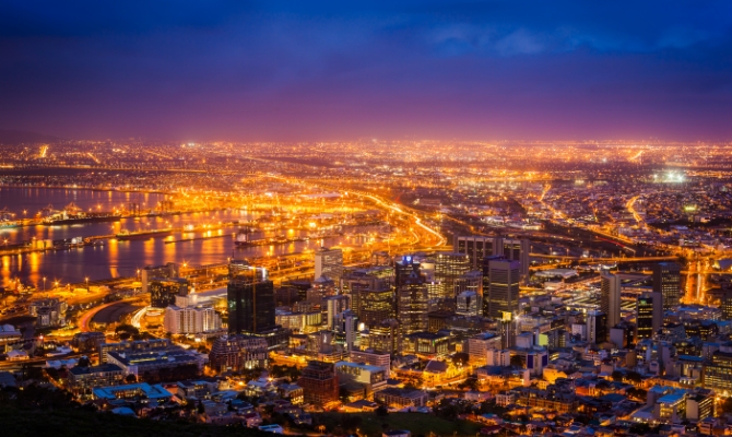 Photo of Cape Town at night, South Africa—illuminated by progress, the city’s light symbolizes Africa’s unfolding future.